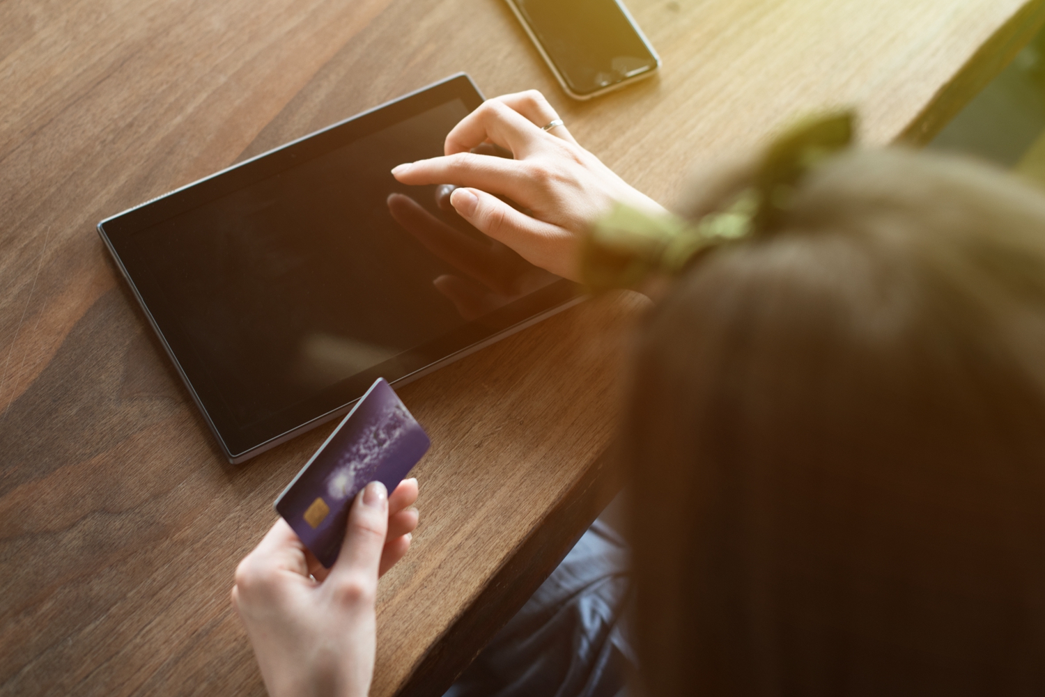 Beautiful young woman shopping online