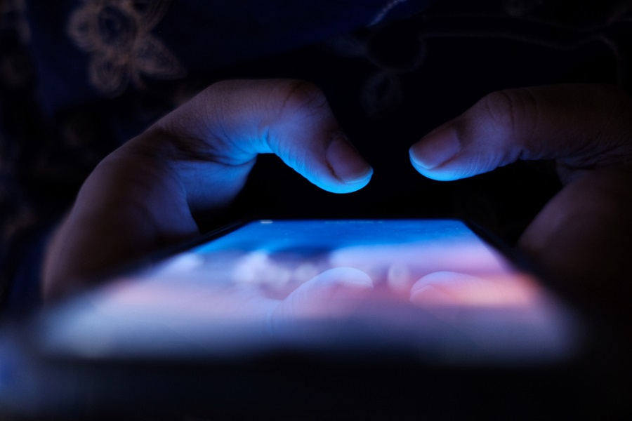 women hand with smart phone using siclal media app