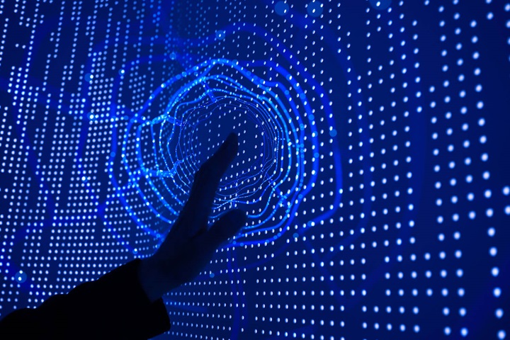 Hand touching data wall