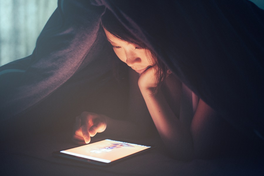 Woman using electronic tablet to crawl the web