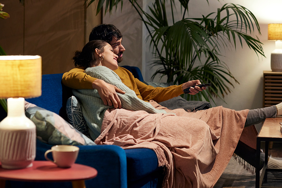 Trust matters - a couple sitting on the sofa watching TV