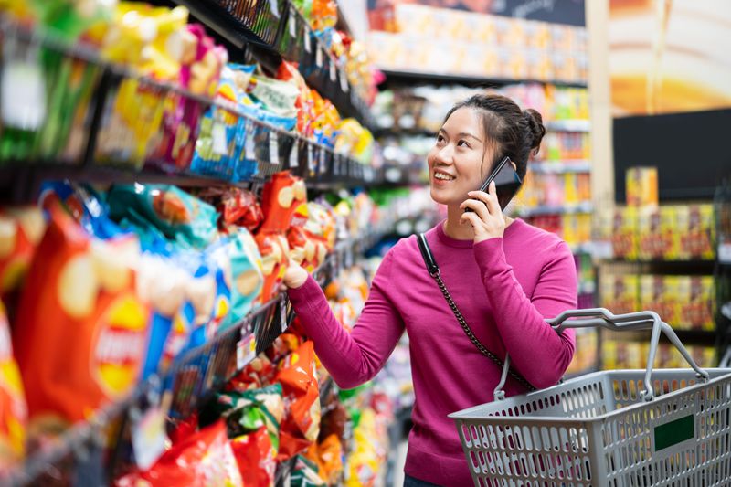 East Asian woman shopping in supermarket